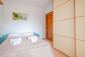 Ένα ή περισσότερα κρεβάτια σε δωμάτιο στο CasaZen, 2 camere, giardino e parking
