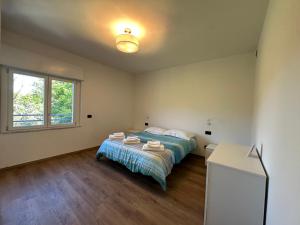 Ένα ή περισσότερα κρεβάτια σε δωμάτιο στο The Quiet Corner- Lake Como