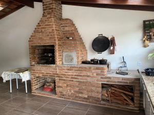 Kuchyň nebo kuchyňský kout v ubytování Chácara dos Teixeira