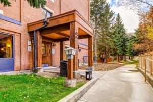 a building with a street light next to a sidewalk at Park Station Elegance 210 in Park City