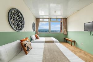 Postel nebo postele na pokoji v ubytování Jiufen Nostalgic Inn + 37 fotografií