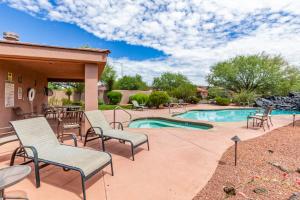 a patio with chairs and a swimming pool at Santa Clara Sunrise in Santa Clara
