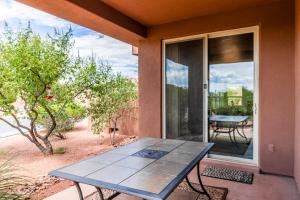 a table on the porch of a house at Santa Clara Sunrise in Santa Clara