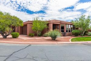 a home in a subdivision with trees and bushes at Santa Clara Sunrise in Santa Clara