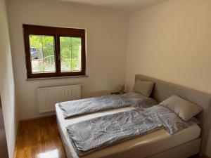 a small bedroom with a bed and a window at Villa Kopic in Opatija +13 photos