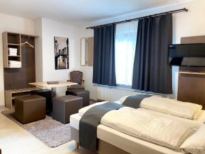 Postel nebo postele na pokoji v ubytování Hana Aparthotel