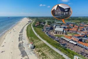 an aerial view of a house on the beach at Vakantiewoning aan Zee in Zoutelande