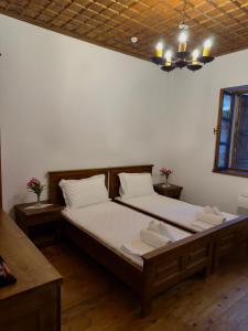 a bedroom with a large bed in a room at Villa Merkaj, Berat Castle in Berat +97 photos
