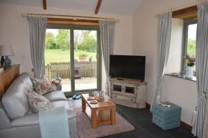 Televiisor ja/või meelelahutuskeskus majutusasutuses Beech cottage is a beautiful 1 bed cottage