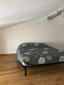 a bedroom with a bed in a room at Bord de Lac in Saint-Julien-du-Verdon