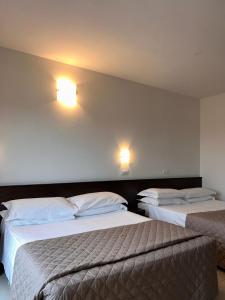 Postel nebo postele na pokoji v ubytování Union Park Hotel
