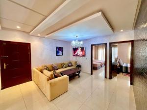a living room with a couch and a table at Family Home -2 in Agadir