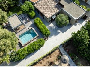 an overhead view of a house with a swimming pool at Villa Les Granges Classé 5 Étoiles in Antisanti