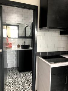 a kitchen with a sink and a counter top at Studio 30 Pied a terre in Brussels +26 photos