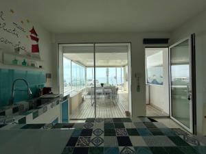 Kuchyň nebo kuchyňský kout v ubytování Il Panorama di Aci e Galatea + 14 fotografií