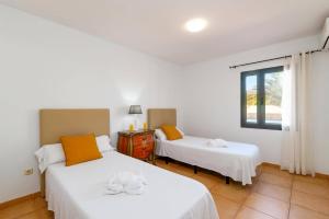 Posteľ alebo postele v izbe v ubytovaní Villa Palm View by Villa Plus