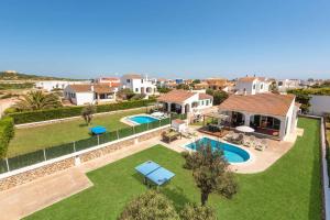 an aerial view of a house with a swimming pool at Villa Pomelo by Villa Plus in Cala en Blanes