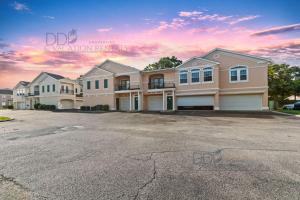 a row of houses in a parking lot at Legacy Villa 704 in Gulfport