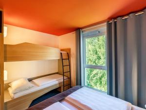 Postel nebo postele na pokoji v ubytování B&B Hotel Konstanz + 22 fotografií