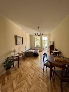 a large living room with a bed and a table at Dominican in Lviv