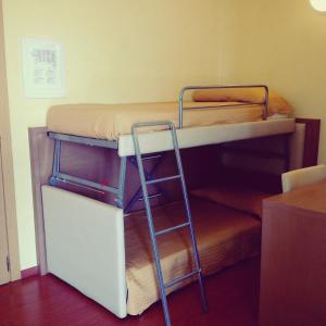 Postel nebo postele na pokoji v ubytování Hotel Paclà