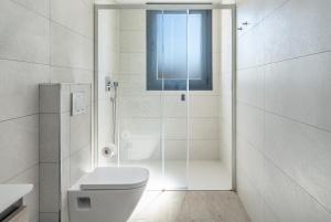 a white bathroom with a shower and a toilet at Casa Vista Azul la Herradura Punta de la Mona in Almuñécar +14 photos