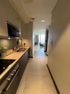 Cozy Stay tesisinde mutfak veya mini mutfak