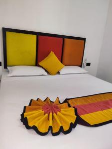 Postel nebo postele na pokoji v ubytování Sigiri Resort
