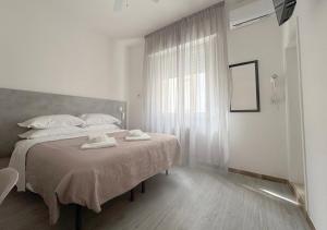 Postel nebo postele na pokoji v ubytování Hotel Ariva