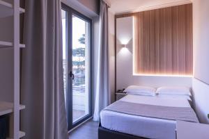 Postel nebo postele na pokoji v ubytování Garner Hotel Rome Aurelia by IHG