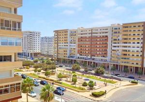 an aerial view of a city with tall buildings at Family Home -2 in Agadir