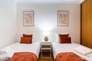 Postel nebo postele na pokoji v ubytování GuestReady - Duplex paradise in Caniço