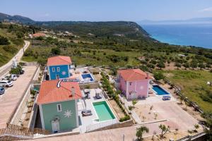 an aerial view of a villa with a view of the ocean at Villa Prasino by Villa Plus in Plateies