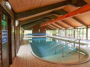 a large swimming pool in a building at Pebble Path at Marine Court in Littlehampton