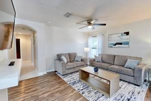 a living room with two couches and a coffee table at Brooksville Retreat! 3 Bed, 2 Bath! in Brooksville +37 photos