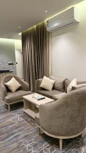 Posezení v ubytování الإقامة الذهبية للشقق المخدومة Golden Residence Hotel