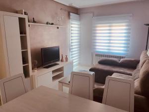 a living room with a couch and a table at Casa esperanza in Soria