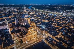 an aerial view of a city at night at Italian Experience-Dafne Suite in Pavia