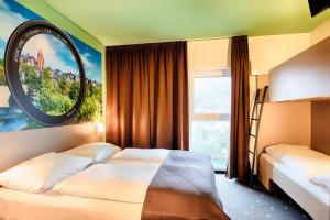 Postel nebo postele na pokoji v ubytování B&B Hotel Wetzlar + 11 fotografií