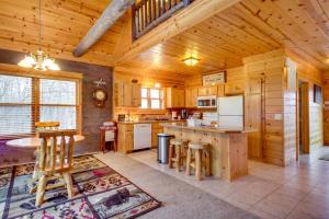a kitchen with wooden walls and a wooden ceiling at Pet-Friendly Garrison Retreat in Garrison
