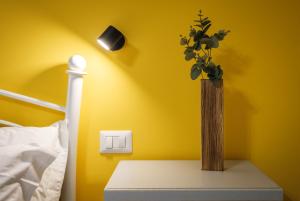 Postel nebo postele na pokoji v ubytování Sa Domu Colorada- Eleganza e comfort nel centro di Villasimius