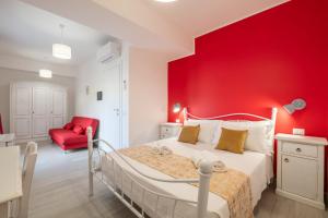 Postel nebo postele na pokoji v ubytování Sa Domu Colorada- Eleganza e comfort nel centro di Villasimius