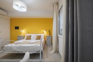 Postel nebo postele na pokoji v ubytování Sa Domu Colorada- Eleganza e comfort nel centro di Villasimius