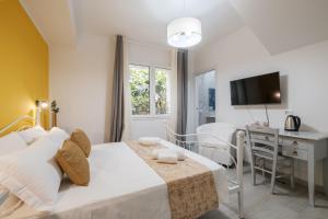 Postel nebo postele na pokoji v ubytování Sa Domu Colorada- Eleganza e comfort nel centro di Villasimius