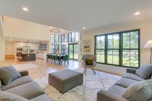 a living room with two couches and a dining room at Nature Escape - Pond, Dock, Fire Pit, Trails in Paris