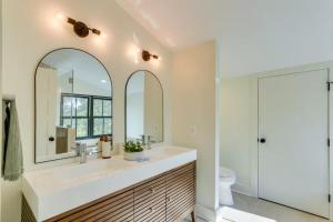 a bathroom with a sink and a mirror at Nature Escape - Pond, Dock, Fire Pit, Trails in Paris +36 photos
