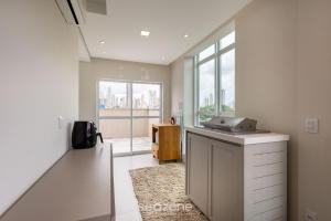 a kitchen with a counter with a sink and windows at Apto 2Q c/ churrasq. prox da praia - BC - STL401 in Balneário Camboriú