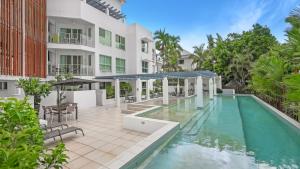 an image of a swimming pool in front of a building at Bayside at 201 Lake Street in Cairns North