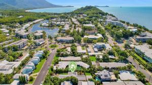 an aerial view of a town next to the water at Poolside Palms Villa in Trinity Beach