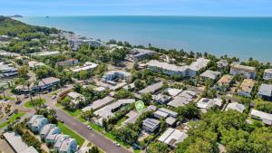 an aerial view of a city with houses and the ocean at Poolside Palms Villa in Trinity Beach